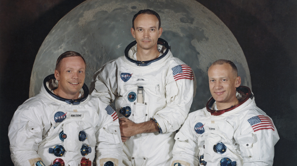 Michael Collins, center, poses with Neil Armstrong, left, and Edwin "Buzz" Aldrin Jr. for a group portrait a few weeks before they took off to the moon in the Apollo 11 mission in 1969.