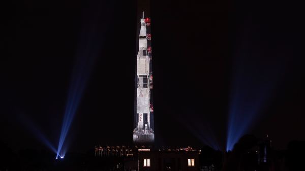 The Smithsonian celebrates the 50th anniversary of the Apollo 11 launch by projecting a 363-foot multi-park visual rocket.