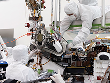 n this August 5, 2019 image, the bit carousel - the heart of sampling and caching subsystem of NASA's Mars 2020 mission -  is attached to the front end of the rover.