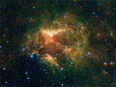 Infrared image from NASA's Spitzer Space telescope shows a cloud of gas and dust carved out by a massive star