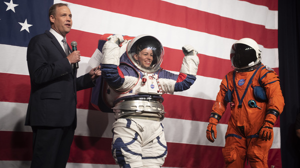 NASA administrator Jim Bridenstine, left, speaks during a demonstration of two NASA spacesuit prototypes for lunar exploration, on Tuesday.