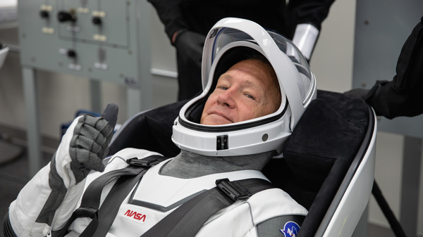 NASA astronaut Douglas Hurley rehearses putting on his SpaceX spacesuit at the Neil A. Armstrong Operations and Checkout Building Kennedy Space Center in Florida, last week.