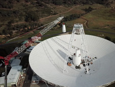 A 400-ton crane lifts the new X-band cone into the 70-meter (230-feet) Deep Space Station 43 dish