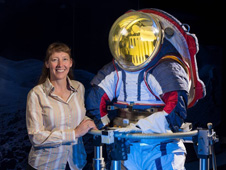 Advanced spacesuit designer Amy Ross of NASA's Johnson Space Center stands with the Z-2, a prototype spacesuit