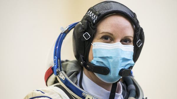 NASA astronaut Kate Rubins is seen during Soyuz qualification exams on Wednesday at the Gagarin Cosmonaut Training Center just outside Moscow. Rubins plans to cast her next vote from space – more than 200 miles above Earth.×