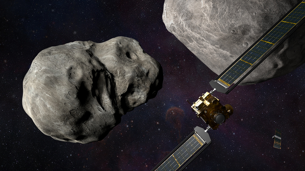 An illustration of the DART spacecraft approaching two asteroids; it will crash into the smaller one to try to change how this space rock orbits its larger companion.