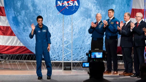 NASA astronaut Jessica Watkins waves at the audience during the astronaut graduation ceremony at Johnson Space Center in Houston, Texas, in January 2020. In April 2022, she will become the first Black woman to live and work on the International Space Station.