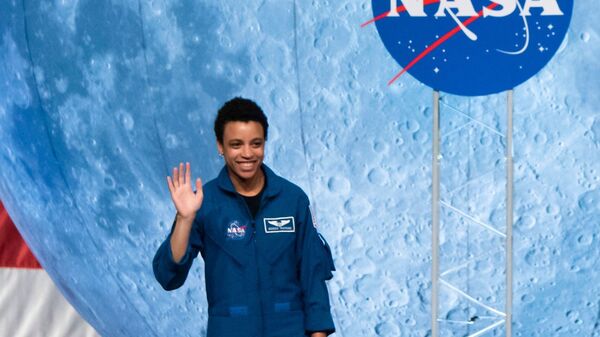 NASA astronaut Jessica Watkins waves at the audience during the astronaut graduation ceremony at Johnson Space Center in Houston Texas, on January 10, 2020.