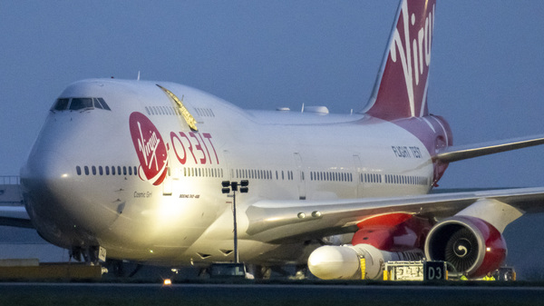 Cosmic Girl, a Boeing 747 modified to carry the LauncherOne rocket under its left wing, took off from the new Cornwall Spaceport in Newquay, U.K., Monday night. The craft is seen here hours before taking off.