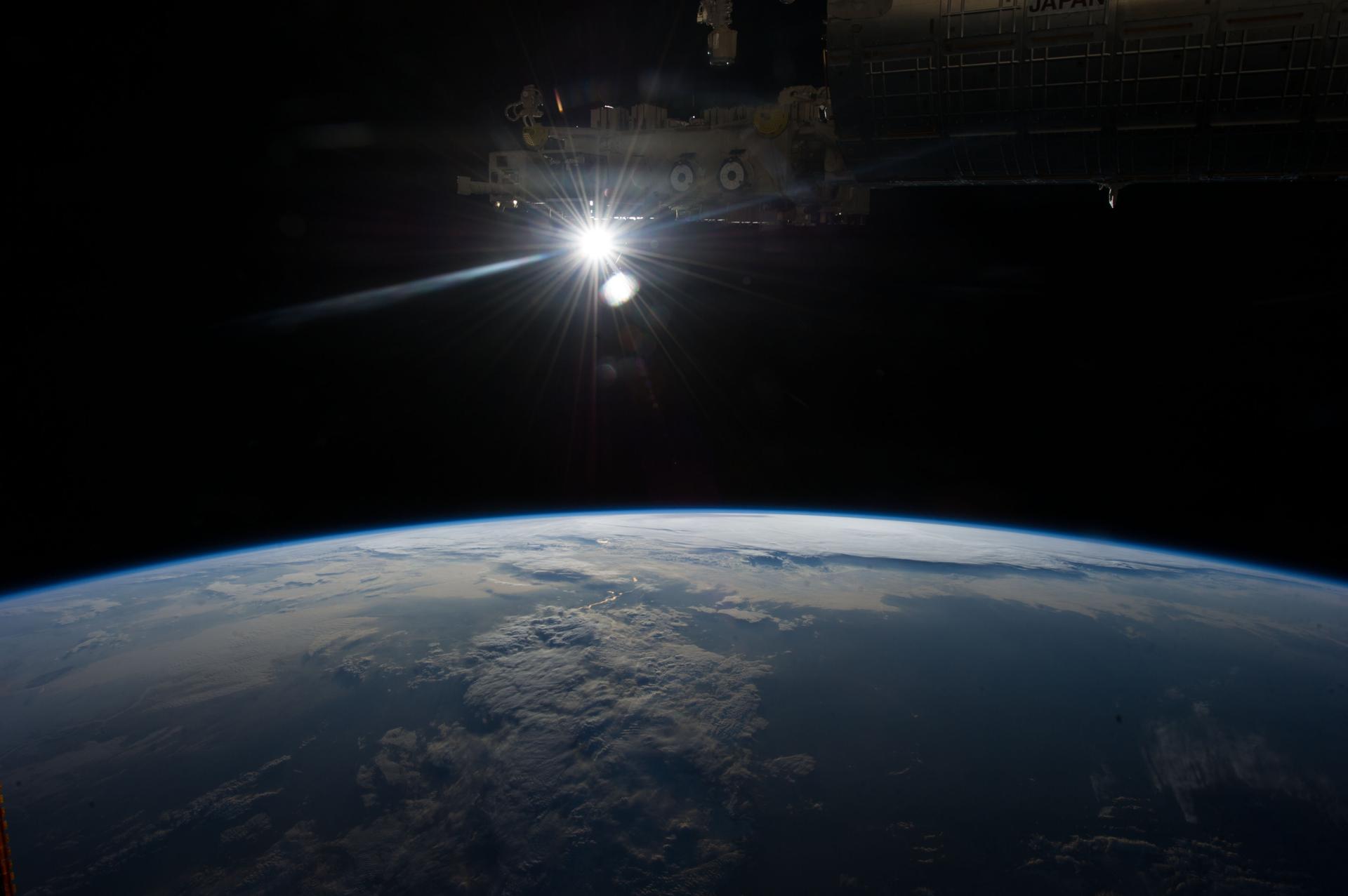 Earth observation taken by the Expedition 35 crew aboard the ISS. The Sun and portions of the forward of the International Space Station are in view.