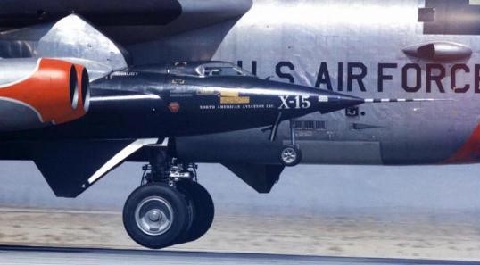 The first captive flight of the X-15-1 rocket plane takes off under the wing of its B-52 Stratofortress carrier aircraft