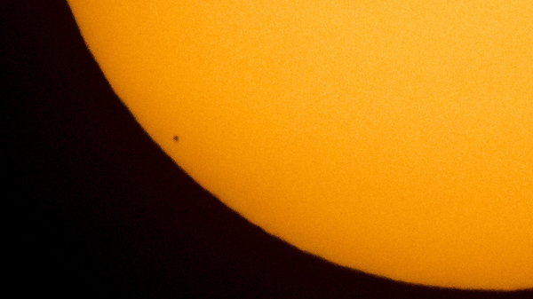 The planet Mercury is seen in silhouette, lower left, as it transits across the face of the sun on May 9, 2016. Another transit of Mercury — the last one for 30 years — will take place Monday.