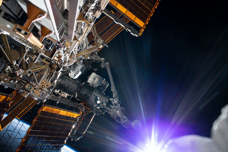 Sun beams during a spacewalk
