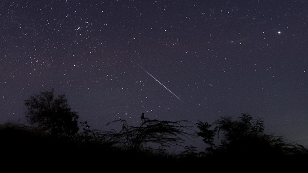 This photo taken late Dec. 14, 2018 with a long time exposure shows a meteor streaking through the night sky over Myanmar during the Geminid meteor shower seen from Wundwin township near Mandalay city.