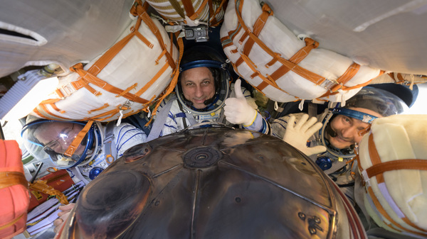 Expedition 66 crew members (left to right) Mark Vande Hei of NASA and cosmonauts Anton Shkaplerov and Pyotr Dubrov of Roscosmos are seen inside their Soyuz MS-19 spacecraft after it landed in a remote area near the town of Zhezkazgan on Wednesday in Zhezkazgan, Kazakhstan.