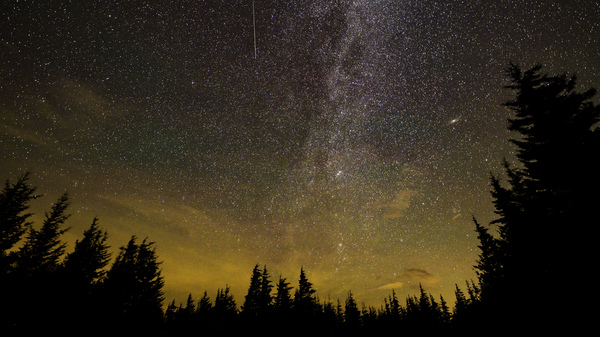 In this 30 second exposure, a meteor streaks across the sky during the annual Perseid meteor shower on Aug. 11, 2021 in Spruce Knob, W.Va.