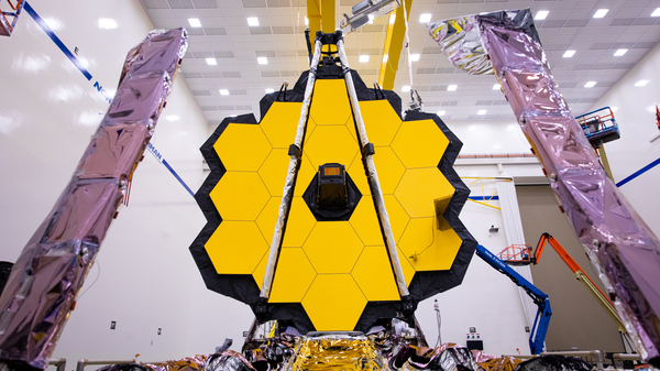 The James Webb Space Telescope (shown here being tested on earth) is expected to reveal some of the most spectacular views of the Universe ever seen.