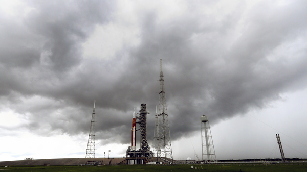 Storm clouds roll in over the NASA moon rocket as it stands ready for launch on Pad 39B for the Artemis 1 mission at the Kennedy Space Center, on Saturday in Cape Canaveral, Fla.