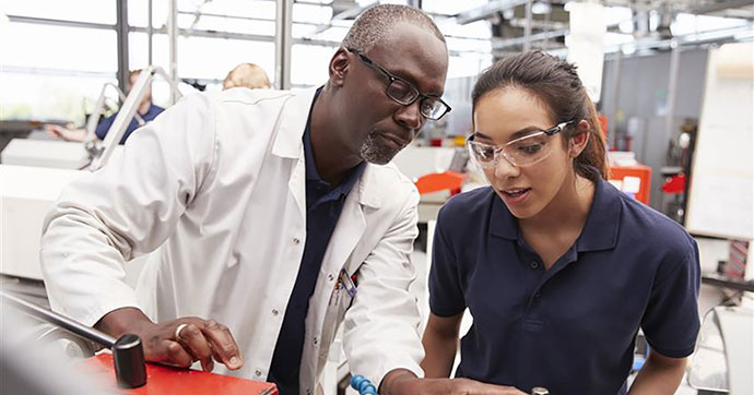 A teacher and a student in a laboratory