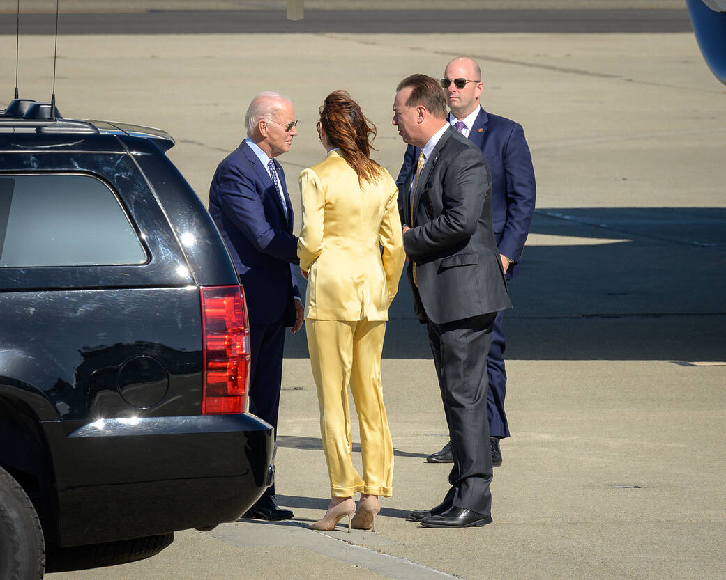 U.S. President Joe Biden stands on the tarmac with Acting Deputy Center Director Dr. David Korsmeyer, and Santa Clara County Supervisor, District 4, Susan Ellenberg.