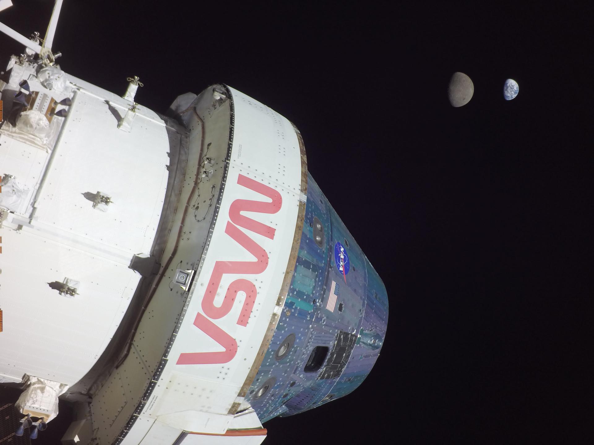 Orion spacecraft in the foreground and the Moon and Earth in the background on Flight Day 13 of the Artemis I mission. Orion reached its maximum distance from Earth during the Artemis I mission when it was 268,563 miles away from our home planet.