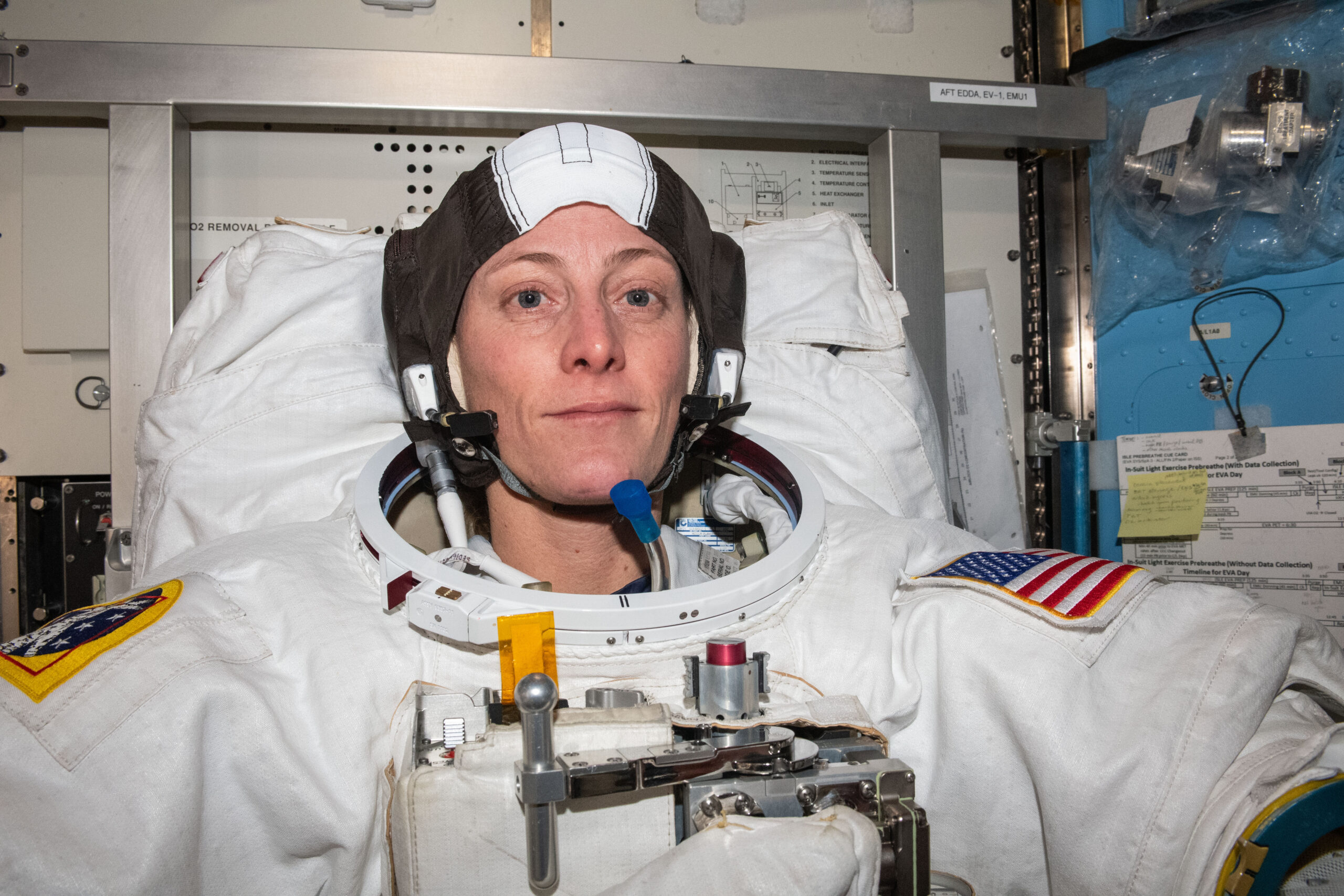 NASA astronaut and Expedition 70 Flight Engineer Loral O'Hara is pictured trying on her spacesuit and testing its components aboard the International Space Station's Quest airlock in preparation for an upcoming spacewalk.