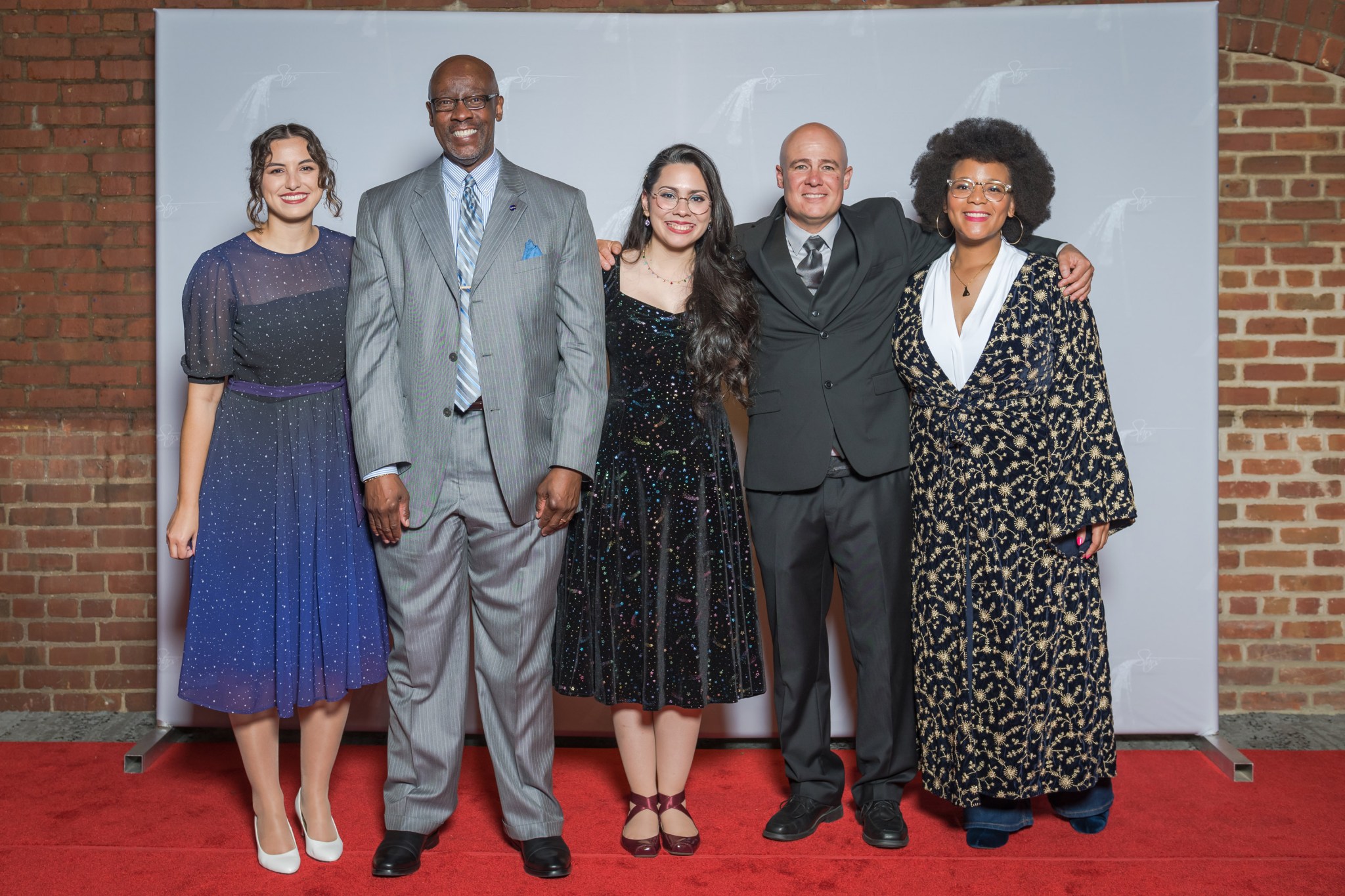 Left to right: Glenn’s Darcy DeAngelis, Dr. Rickey Shyne, Gretchen Moralles-Valle, Carlos Flores, and Dr. Jamesa Stokes share information on NASA Glenn’s technology and mission during “Evening With The Stars.”