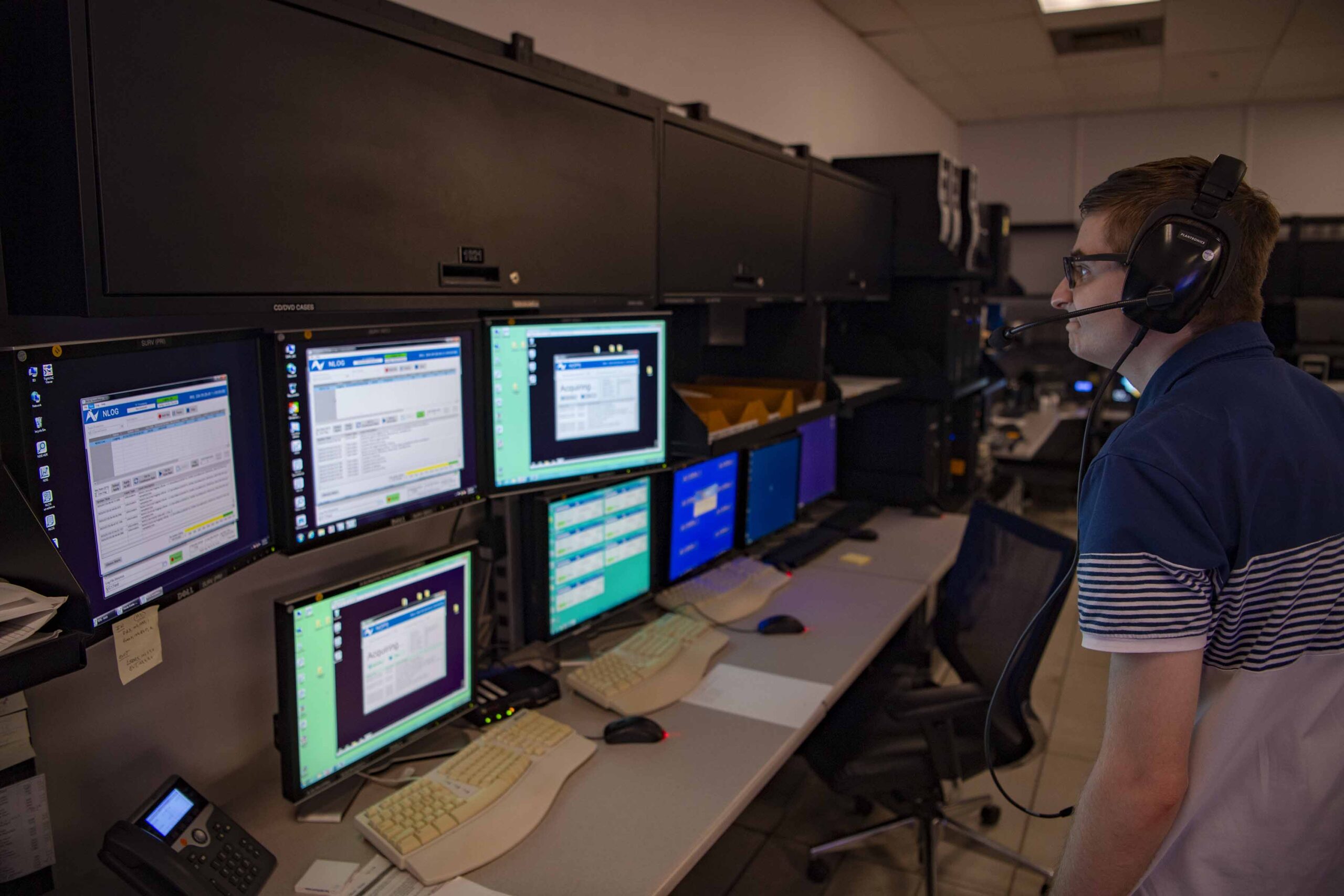 NASA instrumentation engineer Tristan Mooney watching the computer monitors